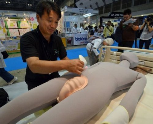 Thiết[-]bị[-]toilet[-]tự[-]động[-]Robohelper[-]-[-]Ảnh:[-]AFP